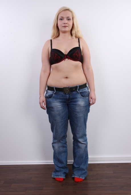 Fat blonde girl Lucie stands butt naked after taking off her clothes