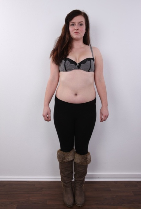 Chubby amateur Ludmila spreads her legs on a stool after getting naked