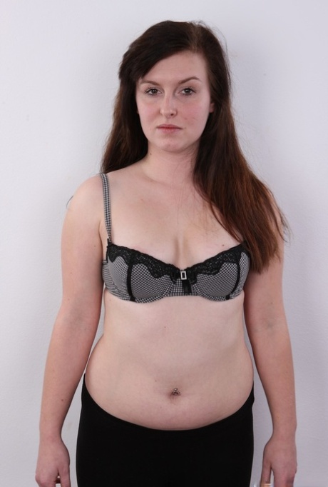 Chubby amateur Ludmila spreads her legs on a stool after getting naked