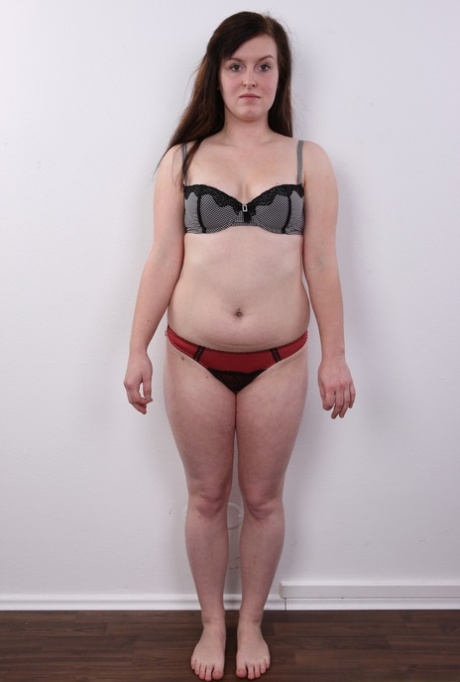 Chubby amateur Ludmila spreads her legs on a stool after getting naked