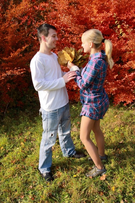 Blonde teen and her boyfriend enjoy an autumn day before sex in a cabin