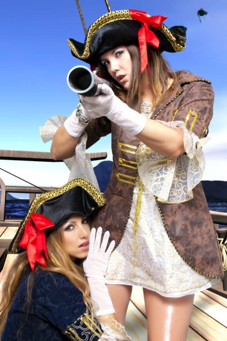 Female pirates partake in lesbian foreplay while on board a vessel