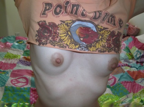Young amateur girl takes selfies while exposing her small boobs and snatch