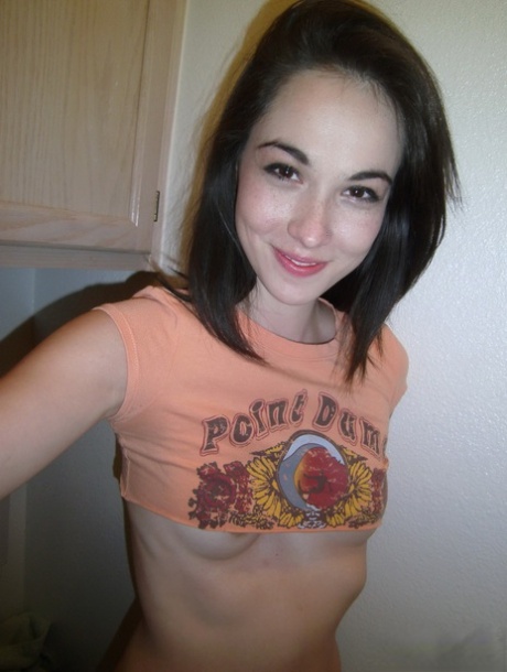 Young amateur girl takes selfies while exposing her small boobs and snatch