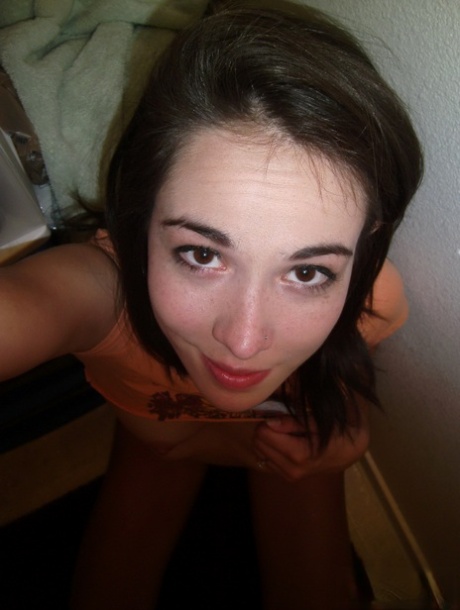 Young amateur girl takes selfies while exposing her small boobs and snatch
