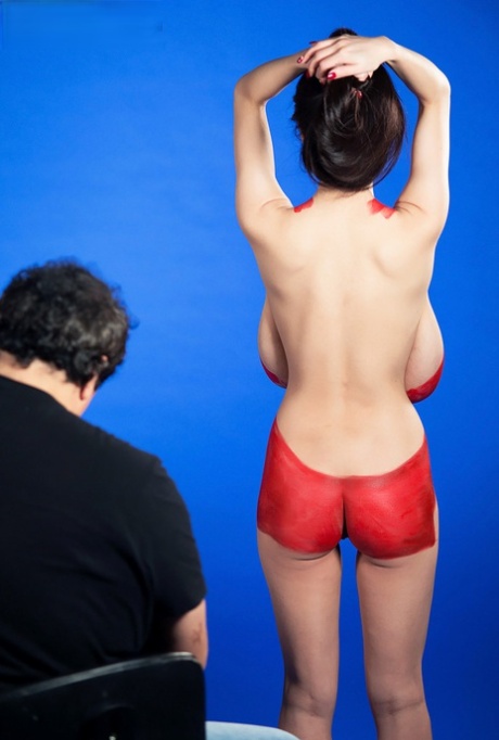 Asian woman Hitomi gets her big saggy breasts covered in body paint