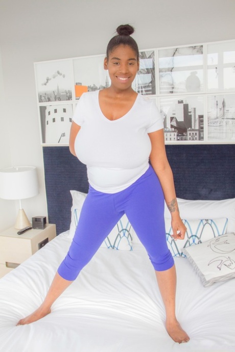 Thick black chick unleashes her huge saggy boobs in her underwear