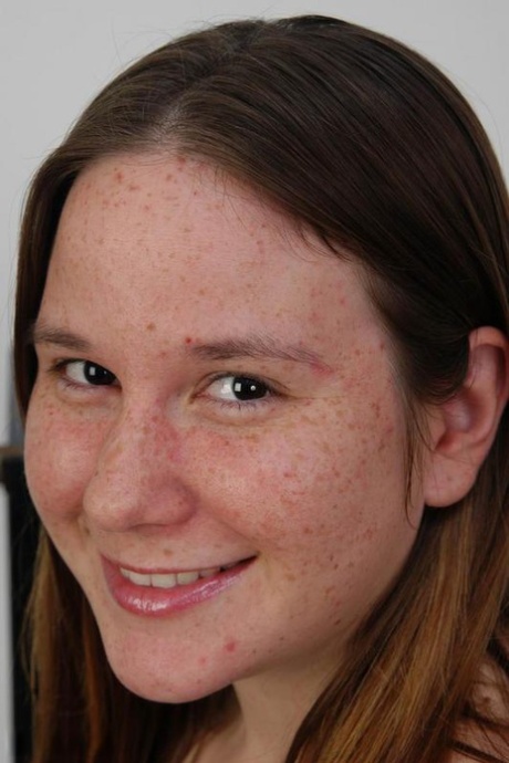 Chubby girl with freckles reveals unshaven pits and pussy on weight bench