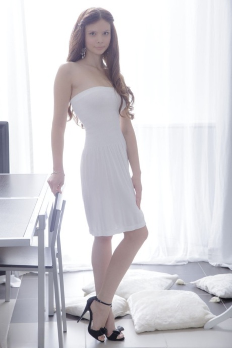 Beautiful teen is relieved of dress and ankle strap heels before fucking