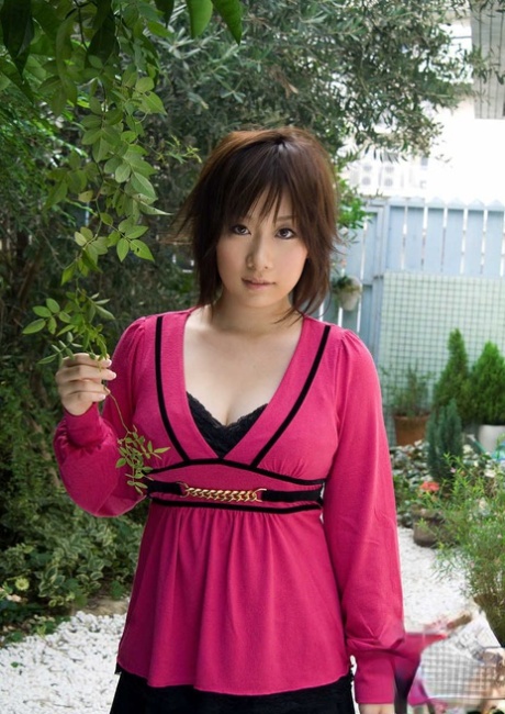 Japanese girl Hanno Nono fondles big naturals while getting mostly naked