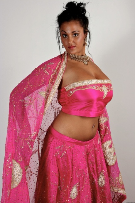 Indian female Keira unveils her big natural tits in bikini bottoms