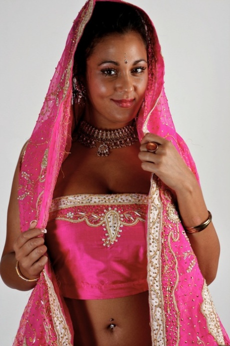 Indian female Keira unveils her big natural tits in bikini bottoms