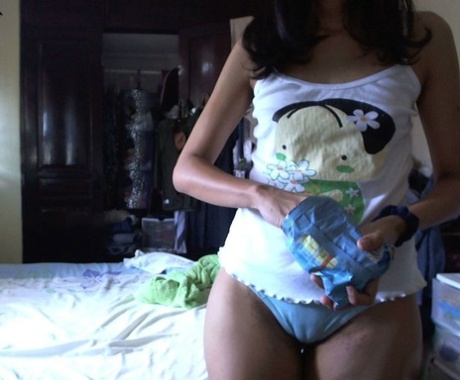 Thick Indian girl with large natural breasts rubs her pussy in her bedroom