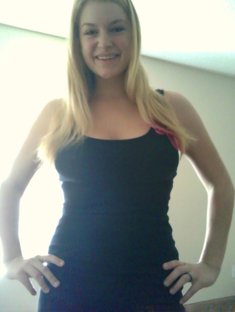 Blonde girl takes non nude selfies in various places around her house
