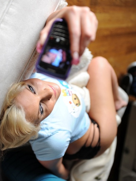 Blonde MILF Phoenix Marie takes self shots while exposing her great body