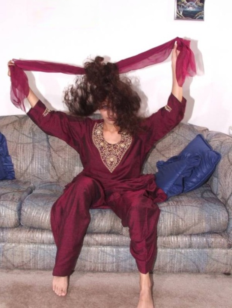 Indian solo girl gets completely naked upon a chesterfield