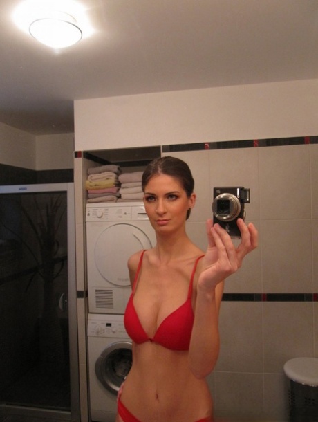 Skinny girl with big tits gets naked for a close-up of her cunt