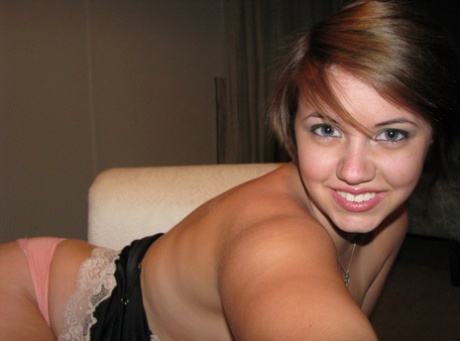 Ex-girlfriend with short hair displays her big boobs while taking selfies