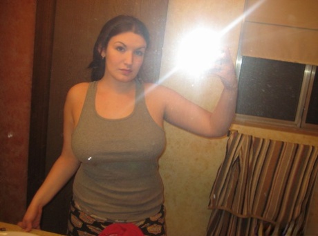 Big titted amateur takes safe for work selfies in a mirror