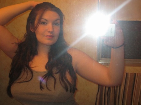 Big titted amateur takes safe for work selfies in a mirror