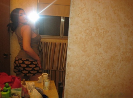 Big titted amateur takes safe for work selfies in a mirror