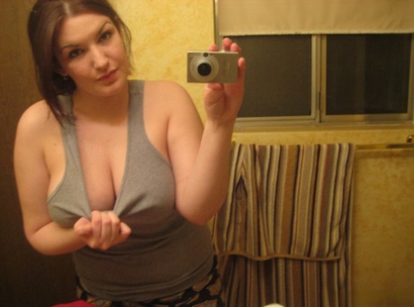 Big titted amateur takes safe for work selfies in a mirror