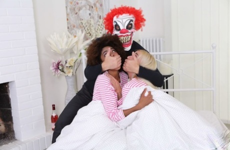 Luna Corazon & Daisy have threesome sex with a guy wearing a clown mask
