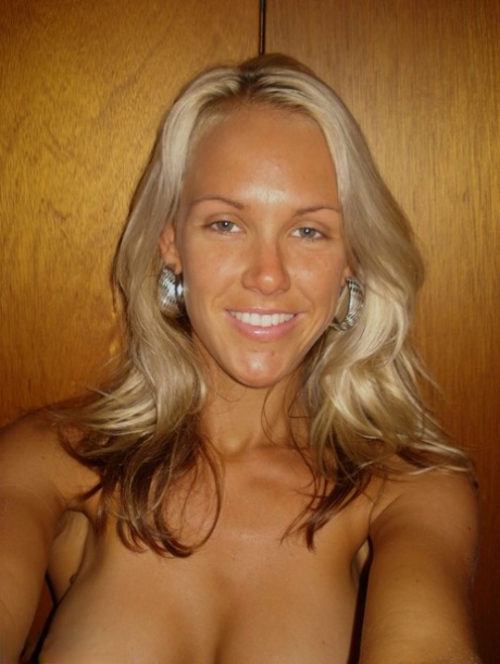 Hot blonde Aussie Jewel displays her big boobs while taking nude selfies