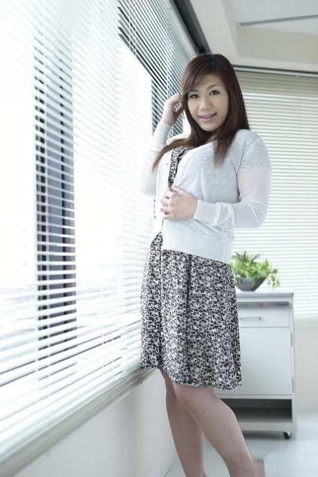 Japanese girl Satomi Katayama unveils her large tits while going nude