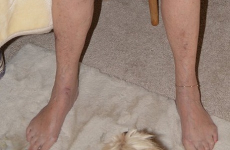 Blonde granny Sparkle stands bare naked after modelling lingerie