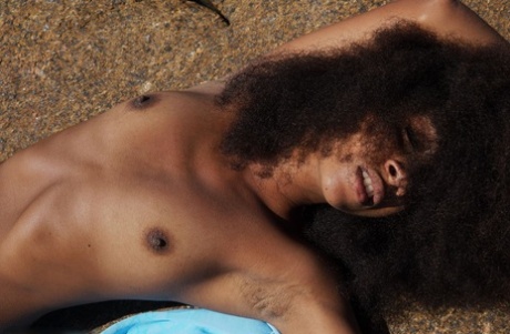 Ebony teen Isadora poses totally naked during oceanside action