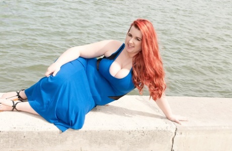 Redhead BBW Amerie Thomas runs water over her big tits after modeling a dress
