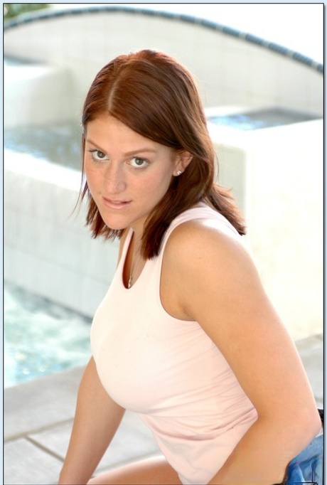 Shapely teen with big tits Eve Laurence strips and poses at the pool