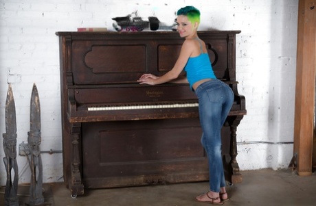 Frisky punk hottie with sexy feet undressing and exposing her goods