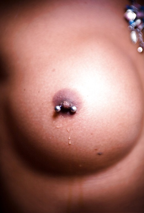Horny blonde Thai ladyboy Kai having fun with her big pierced tits