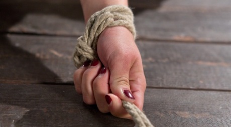 Beautiful brunette Raven Rocket endures corporal punishment in rope bondage