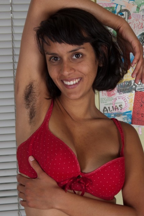 Hairy brunette with natural big tits Sonya N posing naked in solo action