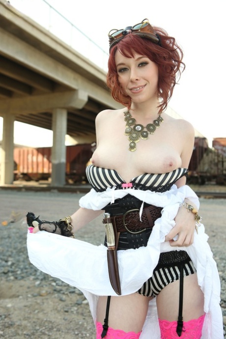Redhead chick Zoey Nixon frees her teen tits from her Steam Punk outfit