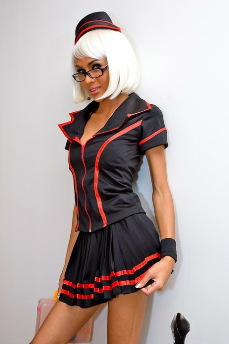 Sexy shemale nurse Mint oils up her cock and toys her big booty