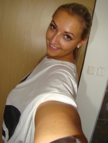 Chubby blonde babe Krystal unveils her huge breasts and shaved vagina