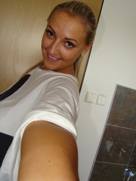 Chubby blonde babe Krystal unveils her huge breasts and shaved vagina