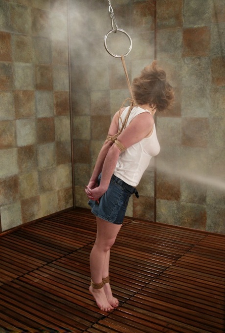 Bound American Brooke Bound enjoys being sprayed with the cold pressure hose