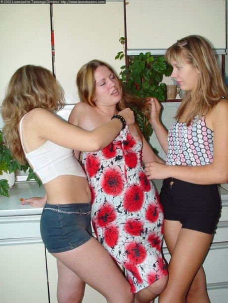 Horny teens with awesome butts strip and kiss each other's clam in the kitchen