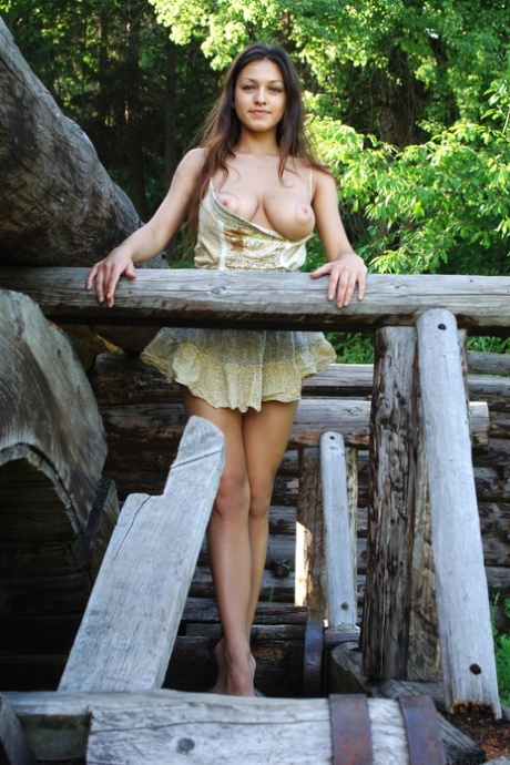 Sweet teen with fine breasts Sofi A poses in a hot dress outdoors