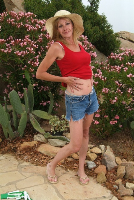 Hot skinny mature gardener Marlee exposes her hot boobs and spreads her legs