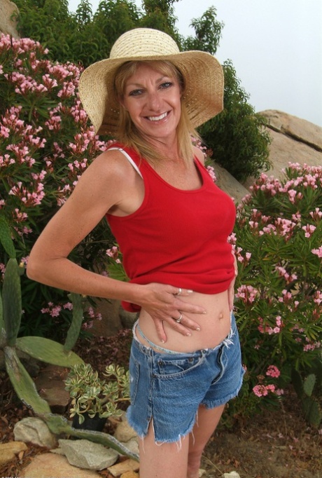 Hot skinny mature gardener Marlee exposes her hot boobs and spreads her legs