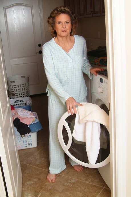 Horny mature Judy doffs her pajamas and reveals her natural tits & hairy twat
