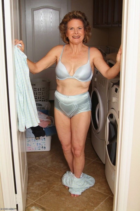 Horny mature Judy doffs her pajamas and reveals her natural tits & hairy twat