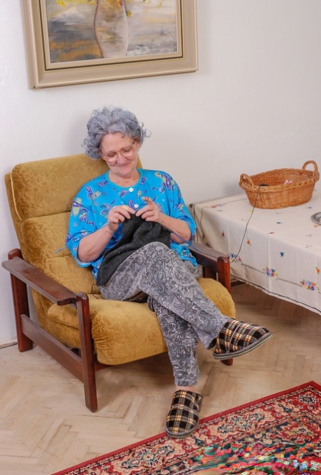 Big boobed teen fucks a curly haired granny with a yellow sex toy