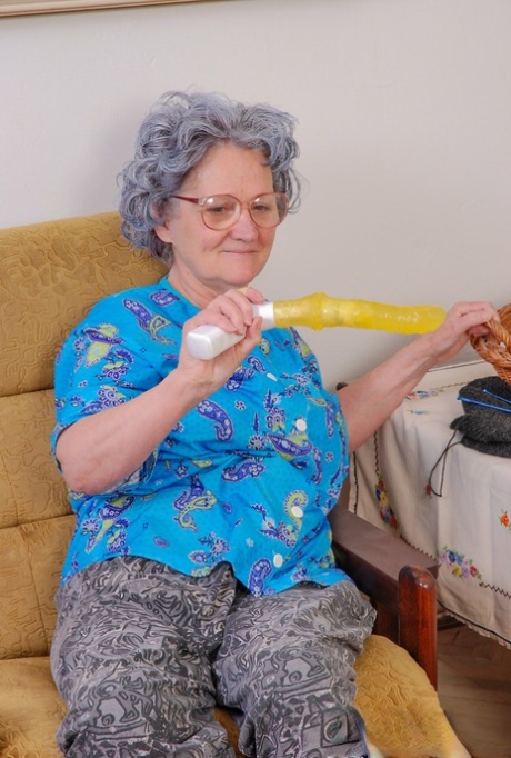 Big boobed teen fucks a curly haired granny with a yellow sex toy